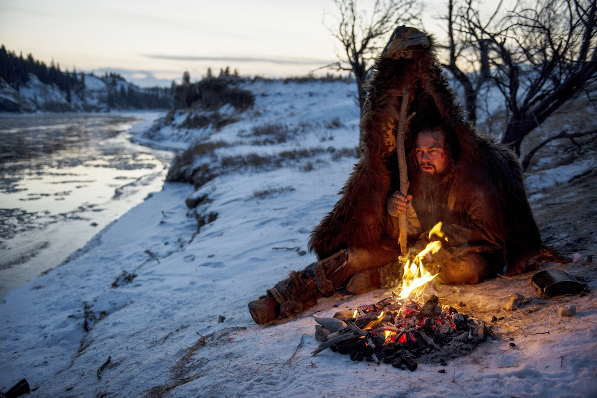 DF-14050R – Hugh Glass (Leonardo DiCaprio) struggles to stay warm during a vicious winter.